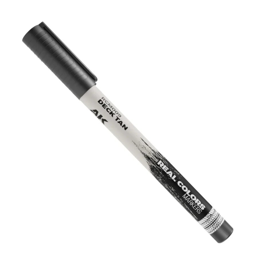 Close-up of AK Interactive Real Colors Deck Tan Acrylic Paint Marker AKRCM009 for precision hobby painting and model detailing.