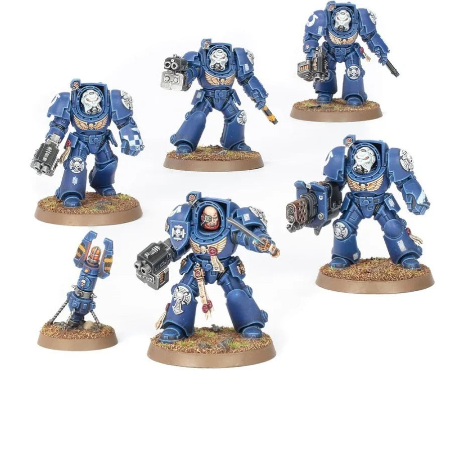 Blue armored Warhammer 40k Space Marine miniatures with weapons, detailed armor, and bases for tabletop gaming