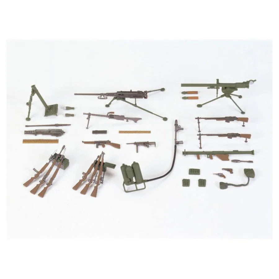 Military model kit parts including rifles, machine guns, and accessories for hobby assembly