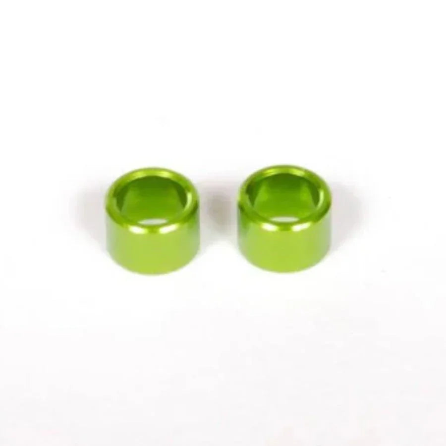 Two bright green aluminum RC car shock absorber caps for model kits and hobbies