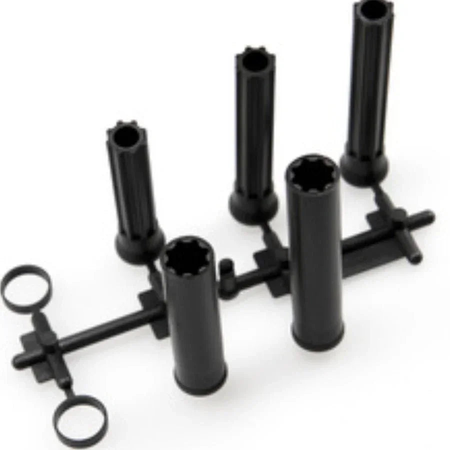 Black plastic model kit parts with cylindrical tubes and connectors for hobby assembly