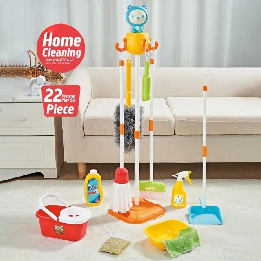 Kids Cleaning Kit – colourful pretend play cleaning toy set with broom, mop, mop bucket, tub and cloths, with the product box on a lounge room background
