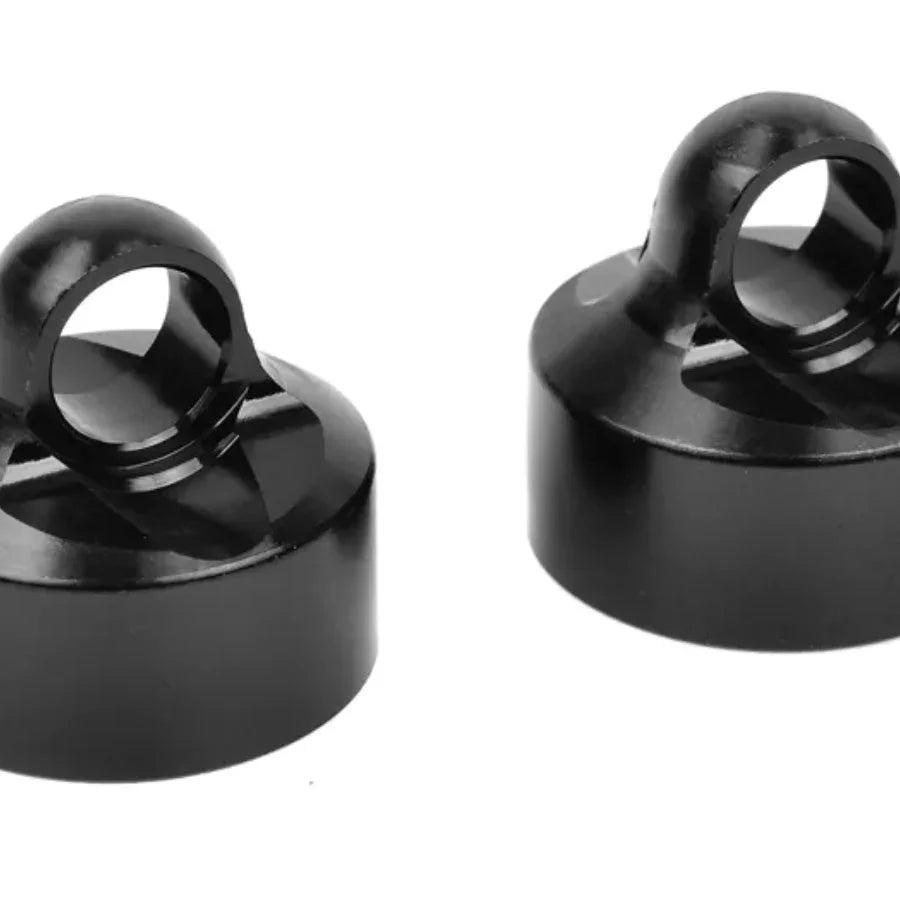 Black plastic model kit parts with circular rings for hobby assembly