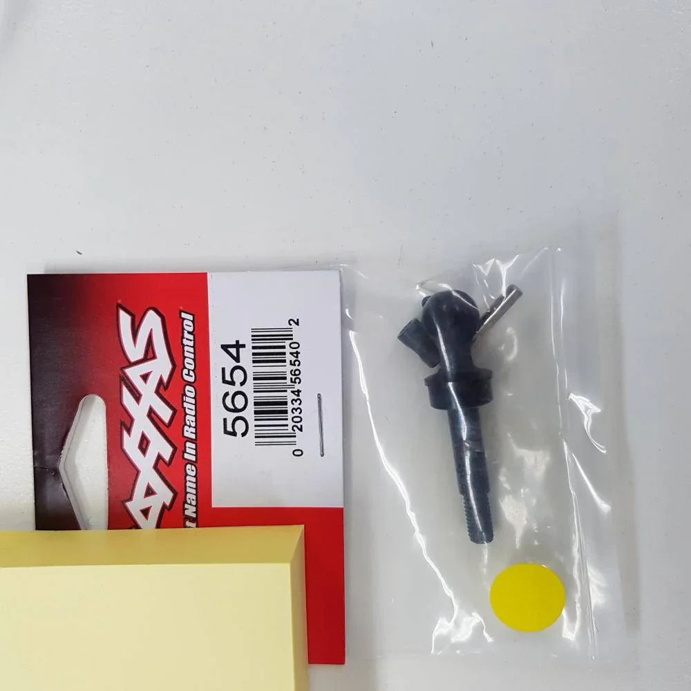 Axial 5654 RC car steering knuckle part, black metal component in plastic bag with packaging