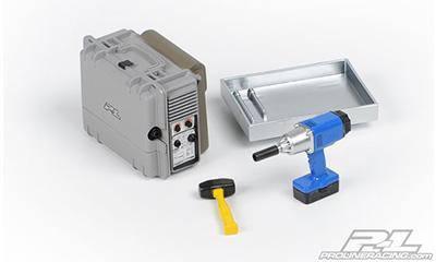 R/C car battery charger, blue electric drill, and metal tray for model kit assembly tools