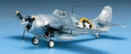 Silver WWII fighter plane model kit with star insignia, detailed propeller and landing gear, hobby collectible