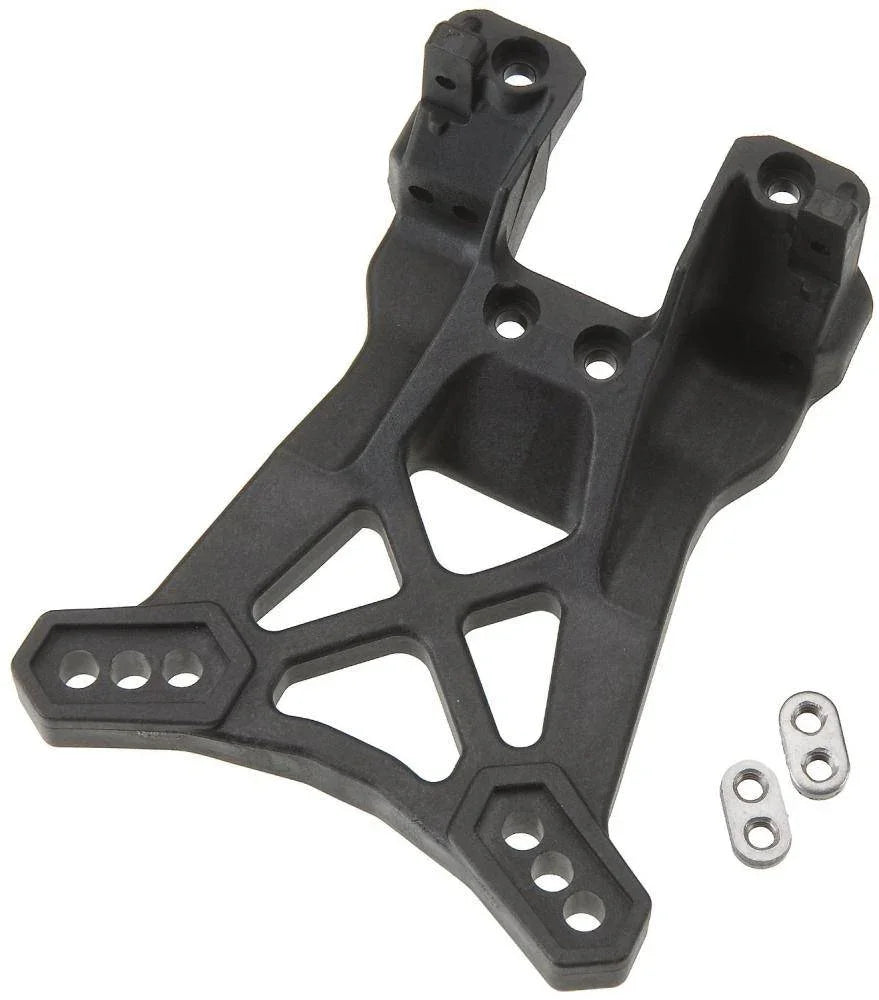 Black RC car chassis with mounting holes and metal hardware, model kit part for hobbyists