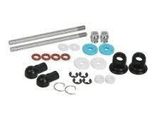 Car suspension bushing kit with metal rods, rubber mounts, and hardware for auto repair