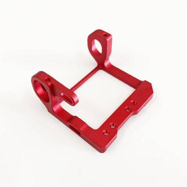 Red aluminum RC car chassis frame with mounting holes and sleek design