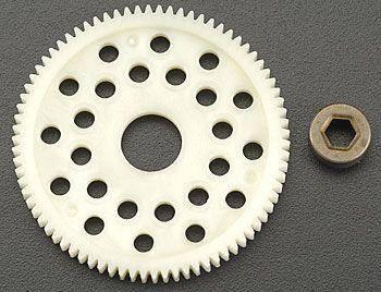 White plastic gear with teeth and holes, plus small metal nut for RC car models