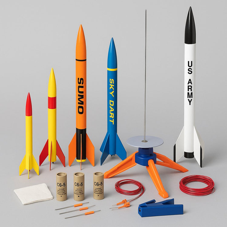 Collection of model rockets and launch kits ready for flight with engines, launch pad, and recovery accessories