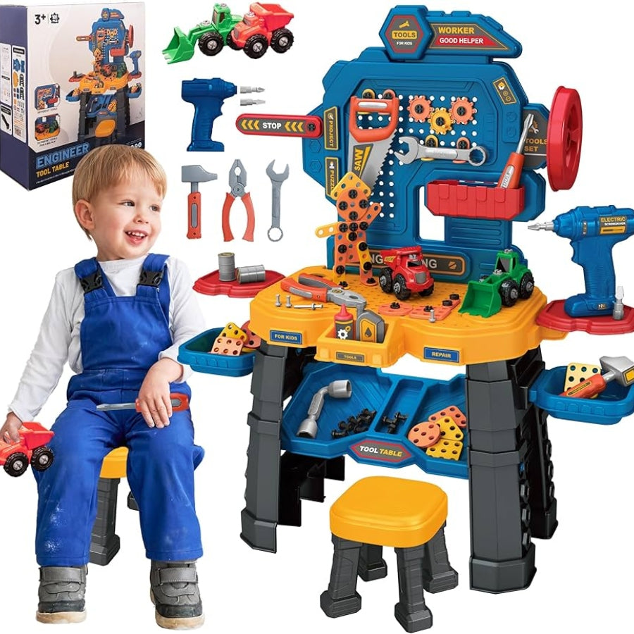 Child in overalls sitting on a toy workbench with tools and machinery