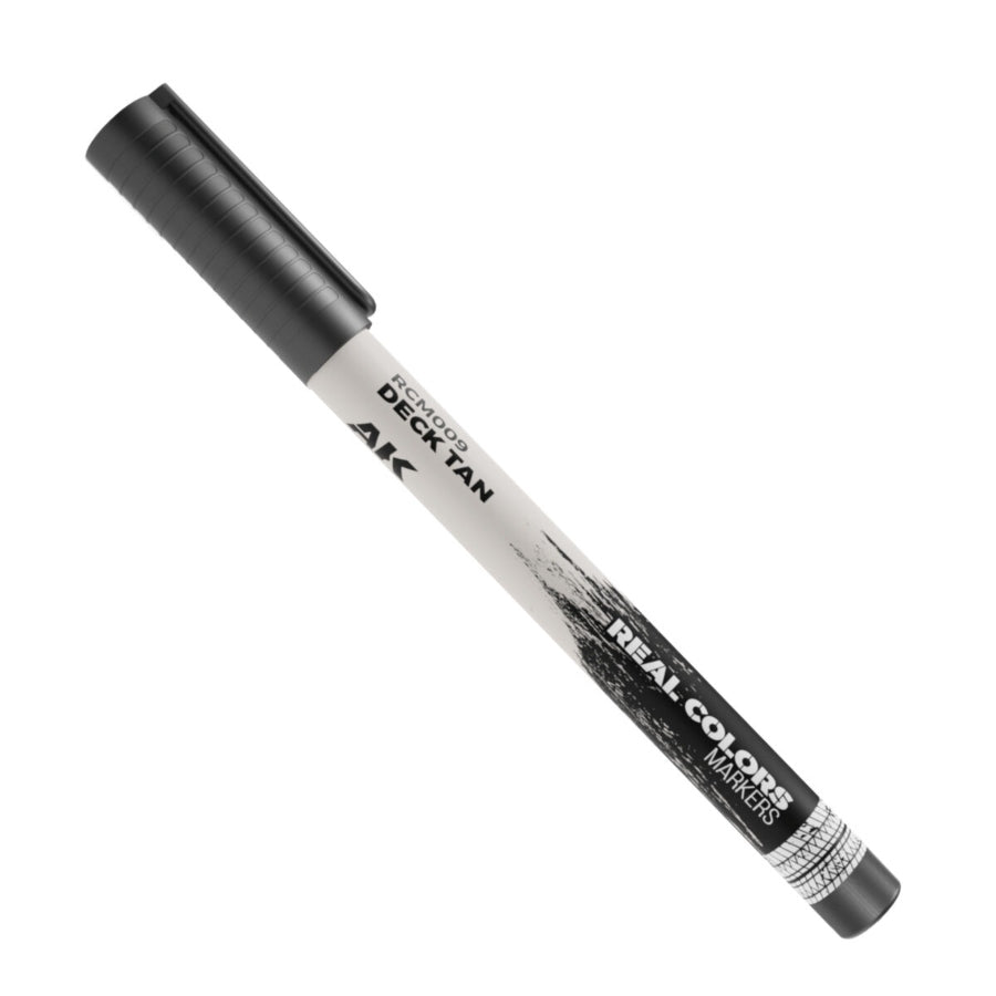 Close-up of AK Interactive Real Colors Deck Tan Acrylic Paint Marker AKRCM009 for precision hobby painting and model detailing.