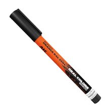Close-up of AK Interactive Real Colors Orange RAL 2004 acrylic paint marker for model kits and hobby projects.