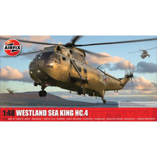 Airfix 1:48 Westland Sea King HC.4 model assembled in olive-drab Royal Navy Commando livery with open side door and folded main rotor blades