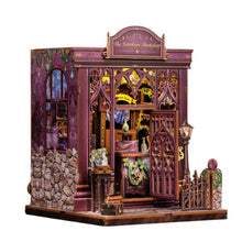 DIY book nook kit featuring a detailed miniature astrology bookshop with purple gothic facade