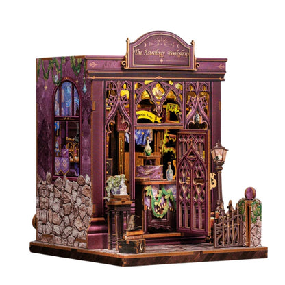 DIY book nook kit featuring a detailed miniature astrology bookshop with purple gothic facade
