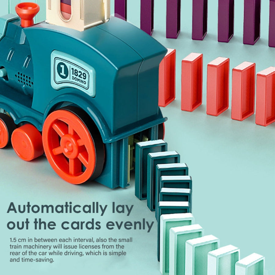 Toy train with dominoes on a light blue background