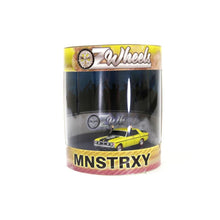Oz Wheels Monster XY Falcon Skid in Cylinder – 1:64 scale die-cast Australian muscle car model in display cylinder, featuring burnout smoke effect.