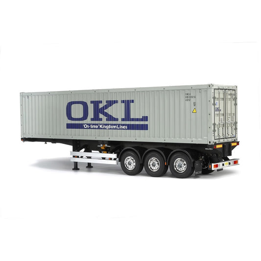 Tamiya 1:14 40-foot ISO container mounted on a three‑axle semi‑trailer chassis kit showing detailed side panels and twist-locks