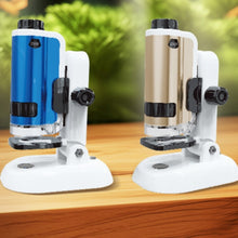 Two microscopes on stands with a blurred green background