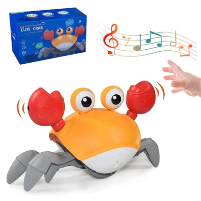 Toy crab with music notes, hand reaching towards it, and toy box in the background