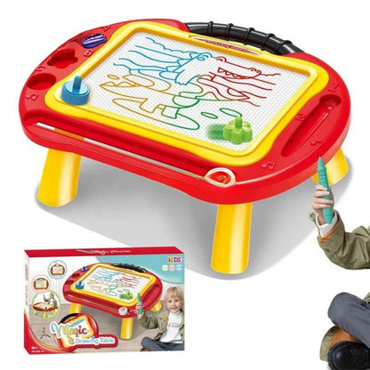 Magic 2-in-1 Drawing Table – kids’ creative art desk drawing surface for learning, colouring, and imaginative play, the product box is displayed, there is a child's hand is seen holding a drawing aide with his legs crossed on a white background