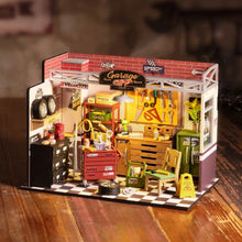 Rolife Garage Workshop DG165 miniature DIY kit with wooden tools, bike, and detailed furniture parts