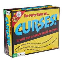 Curses! party game components including Curse cards, Challenge cards, and bell displayed on a table.